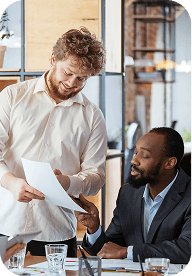 Colleagues sharing data on laptop